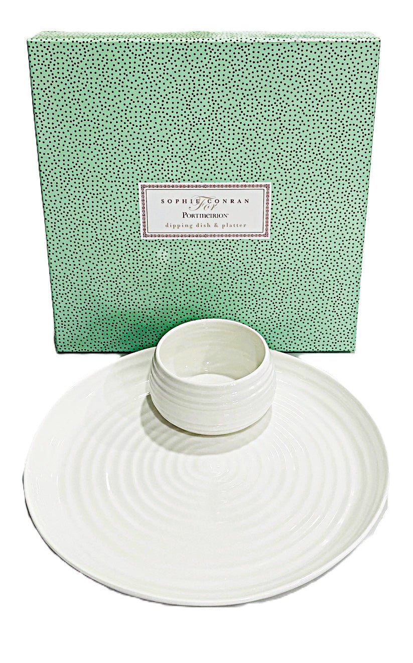 White ceramic dish with a green textured box in the background