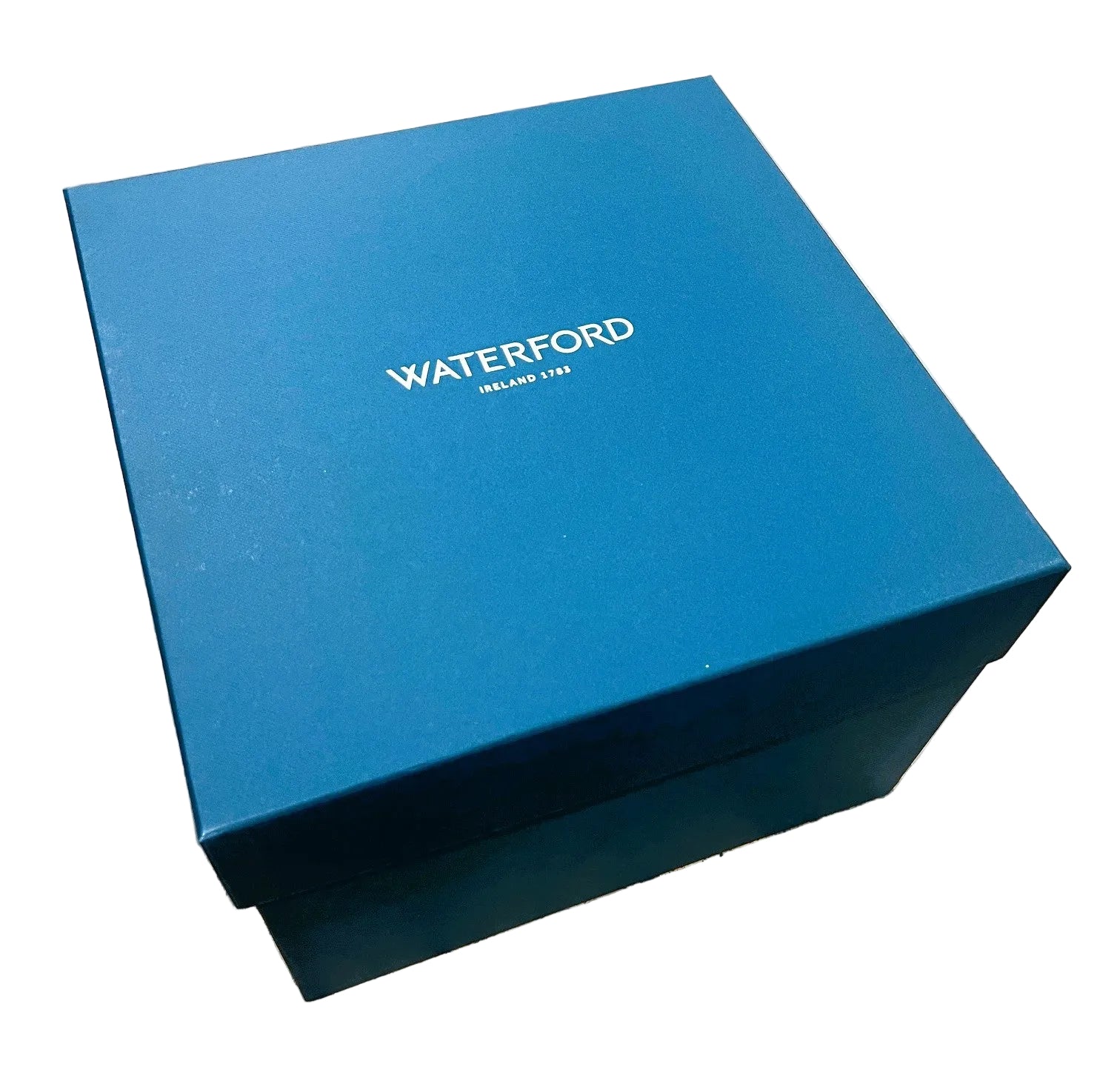 Blue box with 'Waterford' branding on white surface
