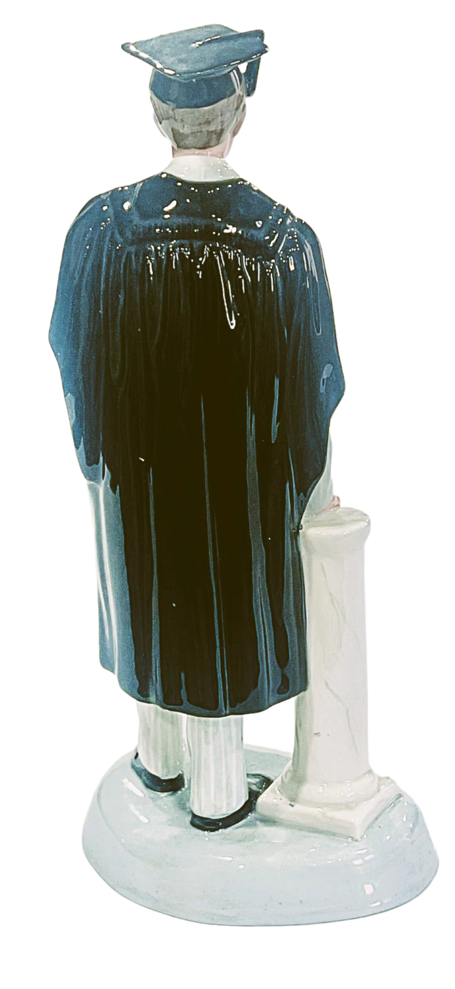 Statue of a person in formal attire with a black cap and gown on a white background