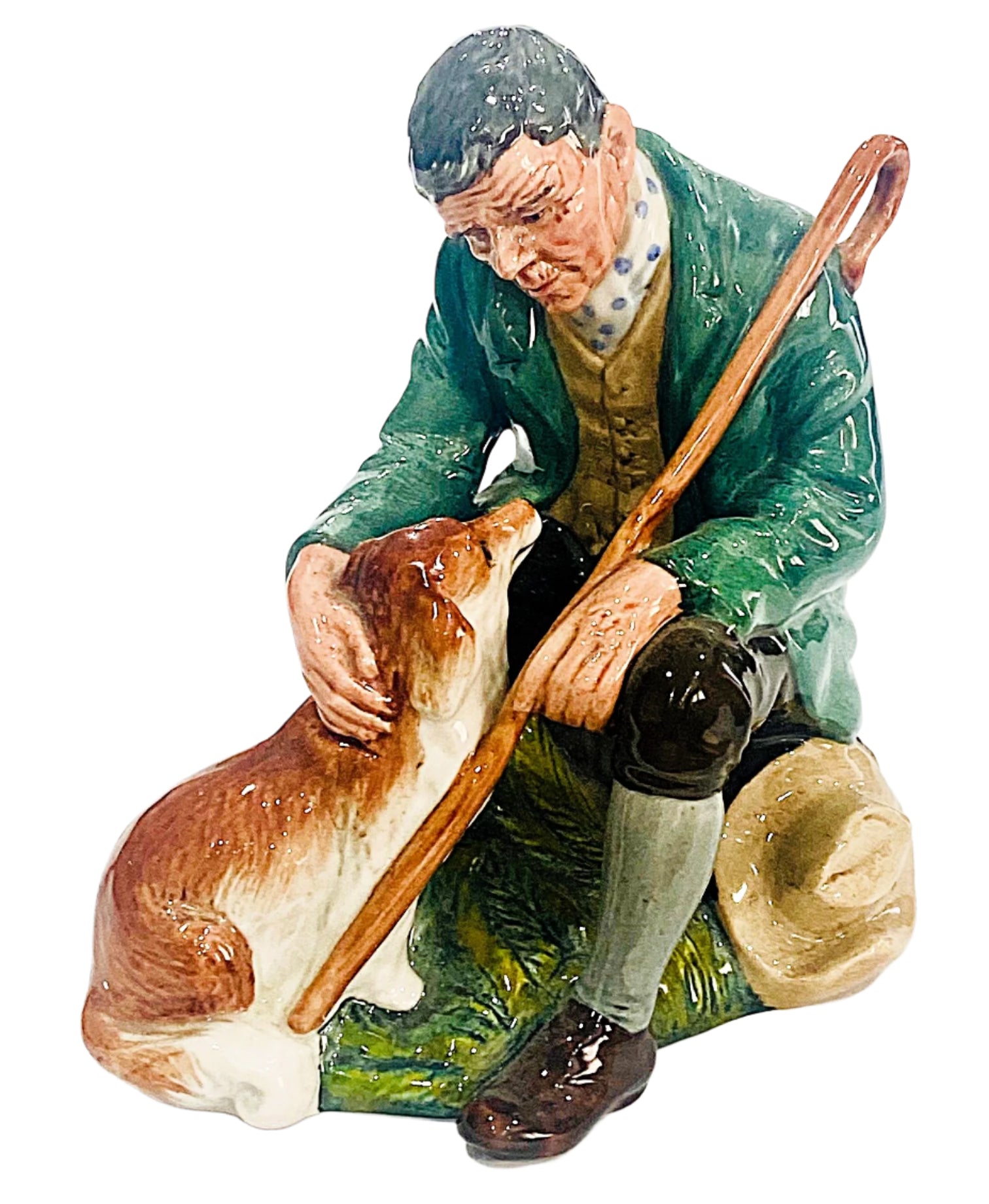 Statue of a man with a dog and a walking stick on a white background