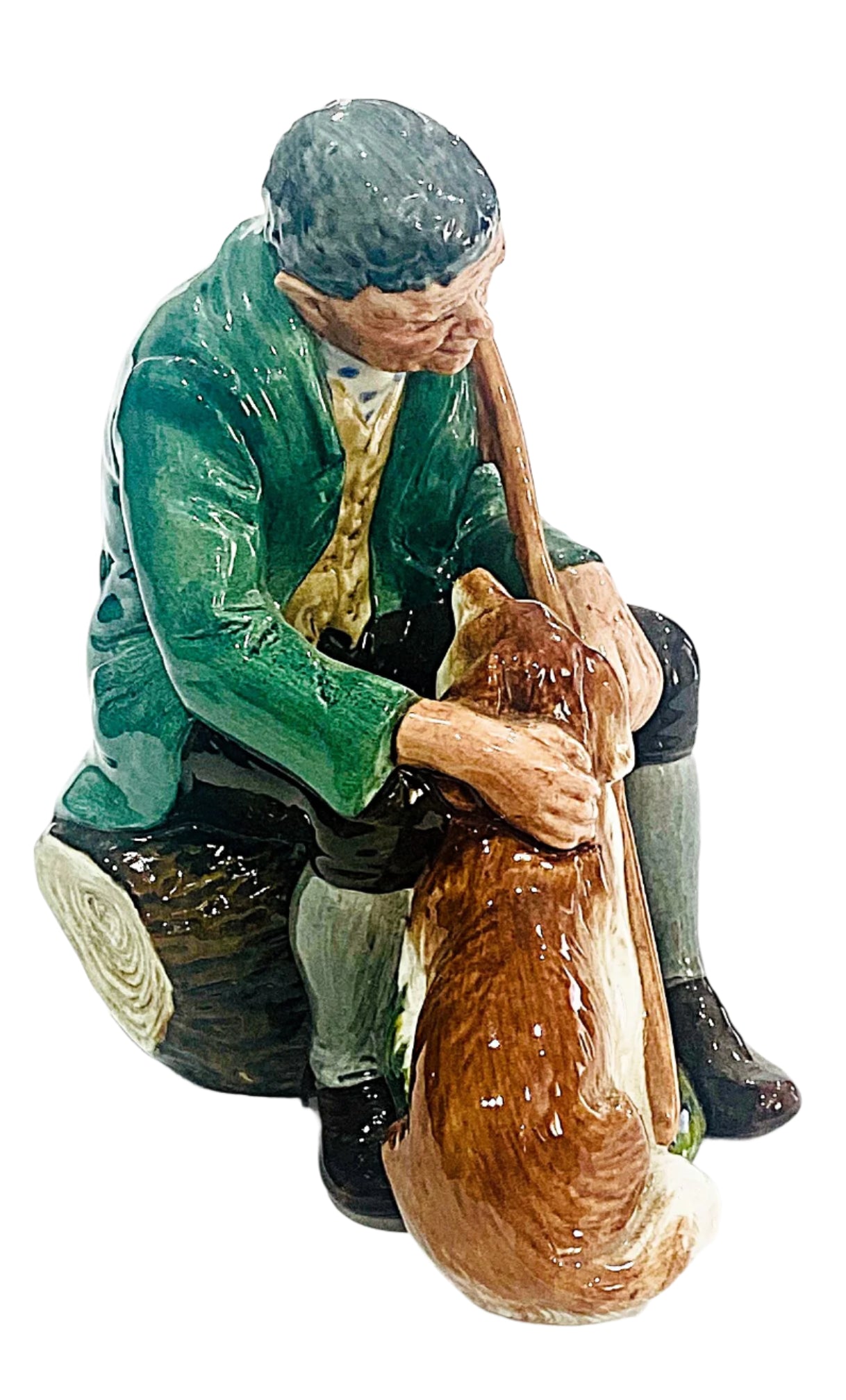 Statue of a man sitting with a dog on a white background