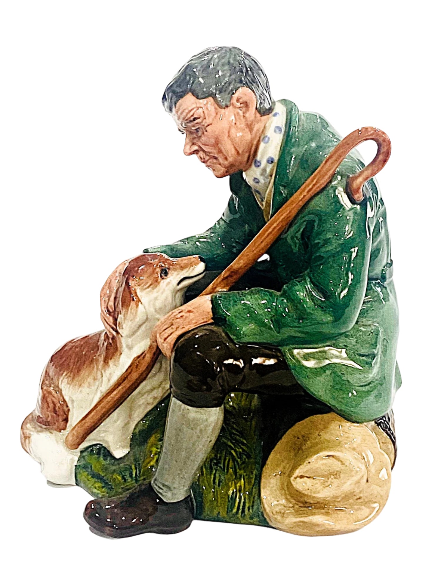 Statue of a man with a dog and a walking stick on a white background