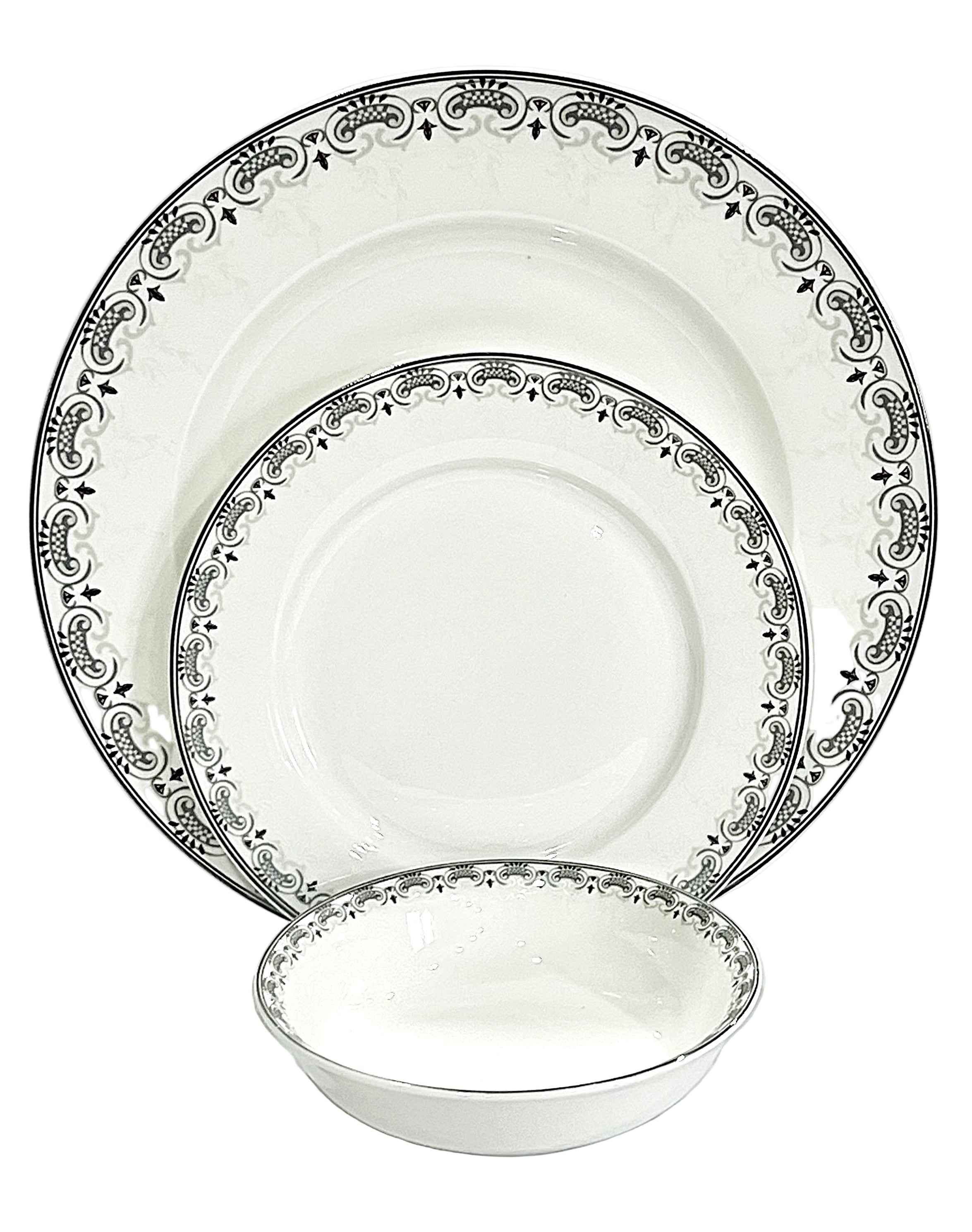 Set of white dinnerware with black decorative border on a white background