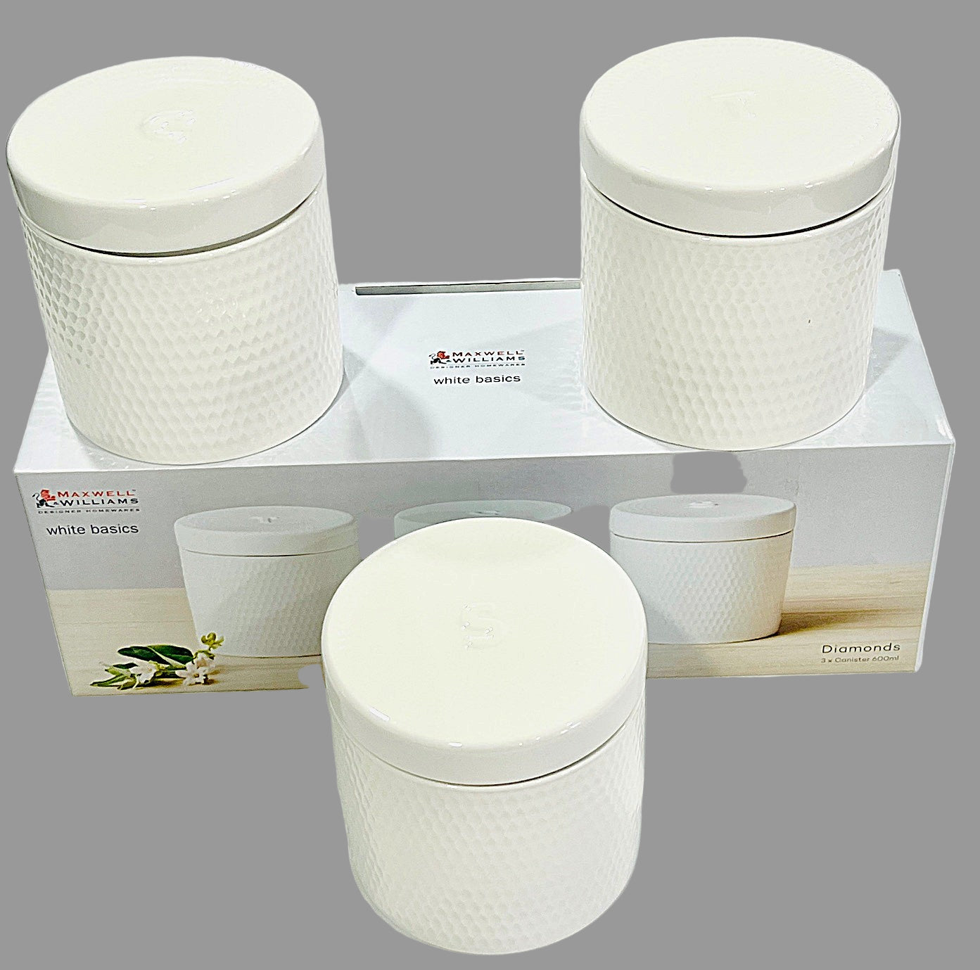 Set of white textured containers with lids on a white background