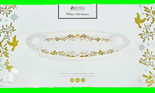 White oval platter with gold floral design on a decorative box
