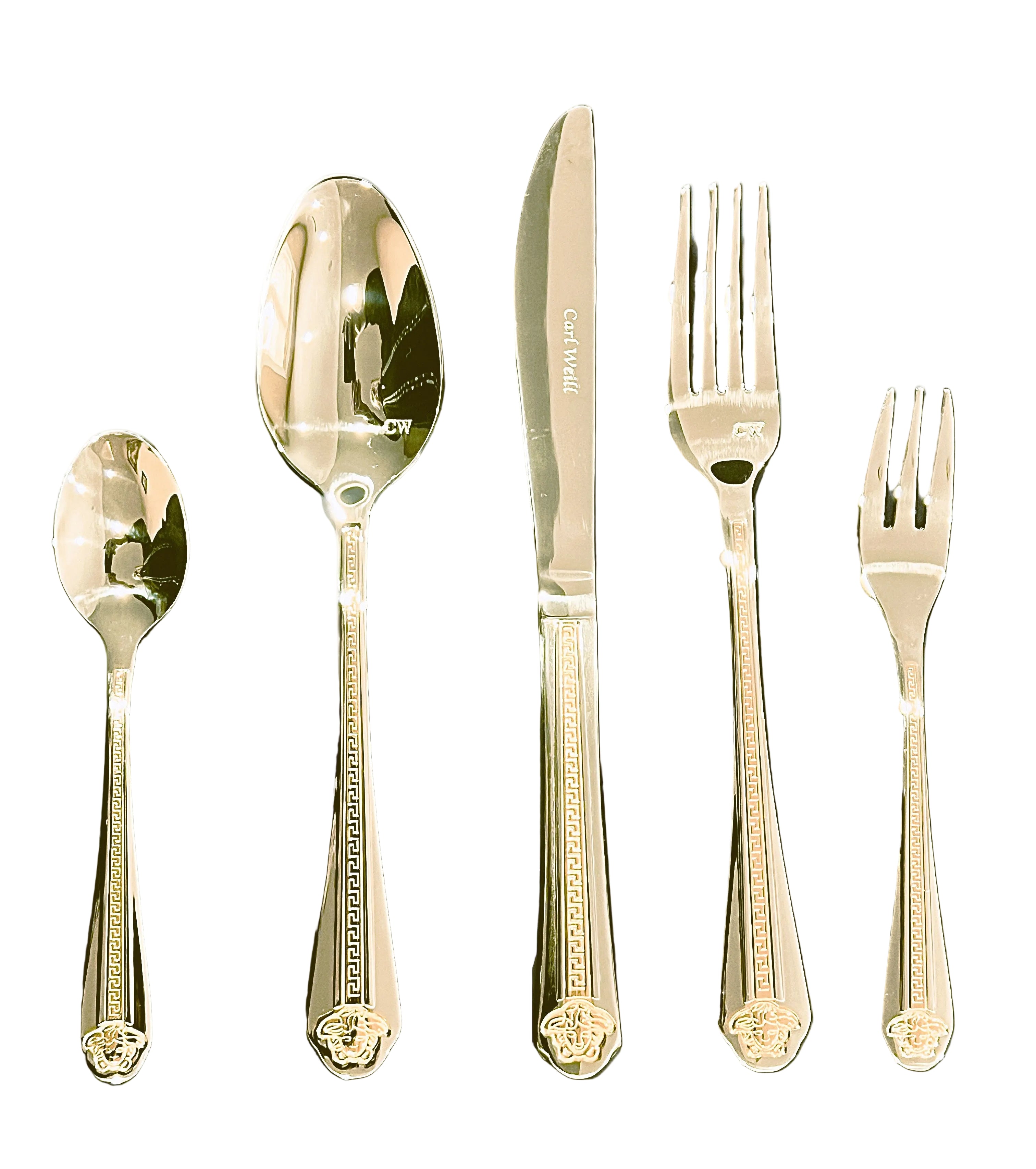 Set of gold cutlery including spoons and forks on a white background