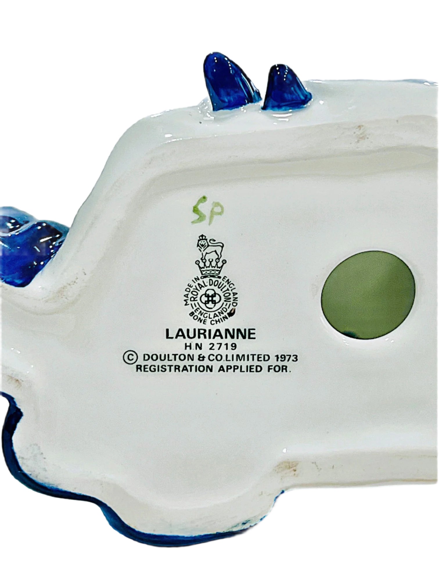 Bone china product with 'Laurianne' branding and registration details on a white background