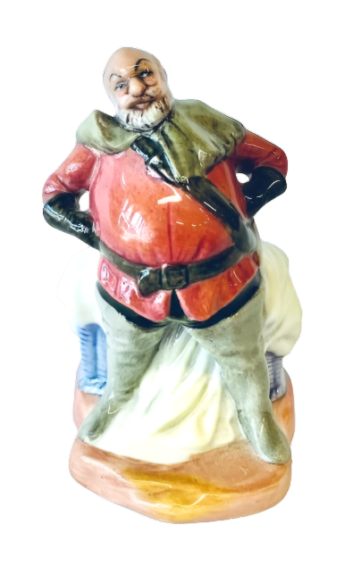 Colorful ceramic figurine of a man in traditional attire on a white background