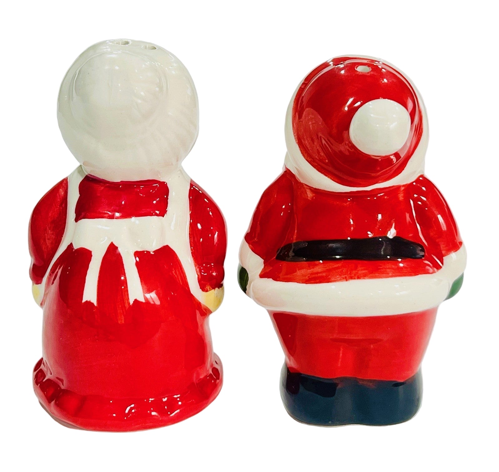 Two ceramic figures, resembling a traditional Santa Claus on a white background.