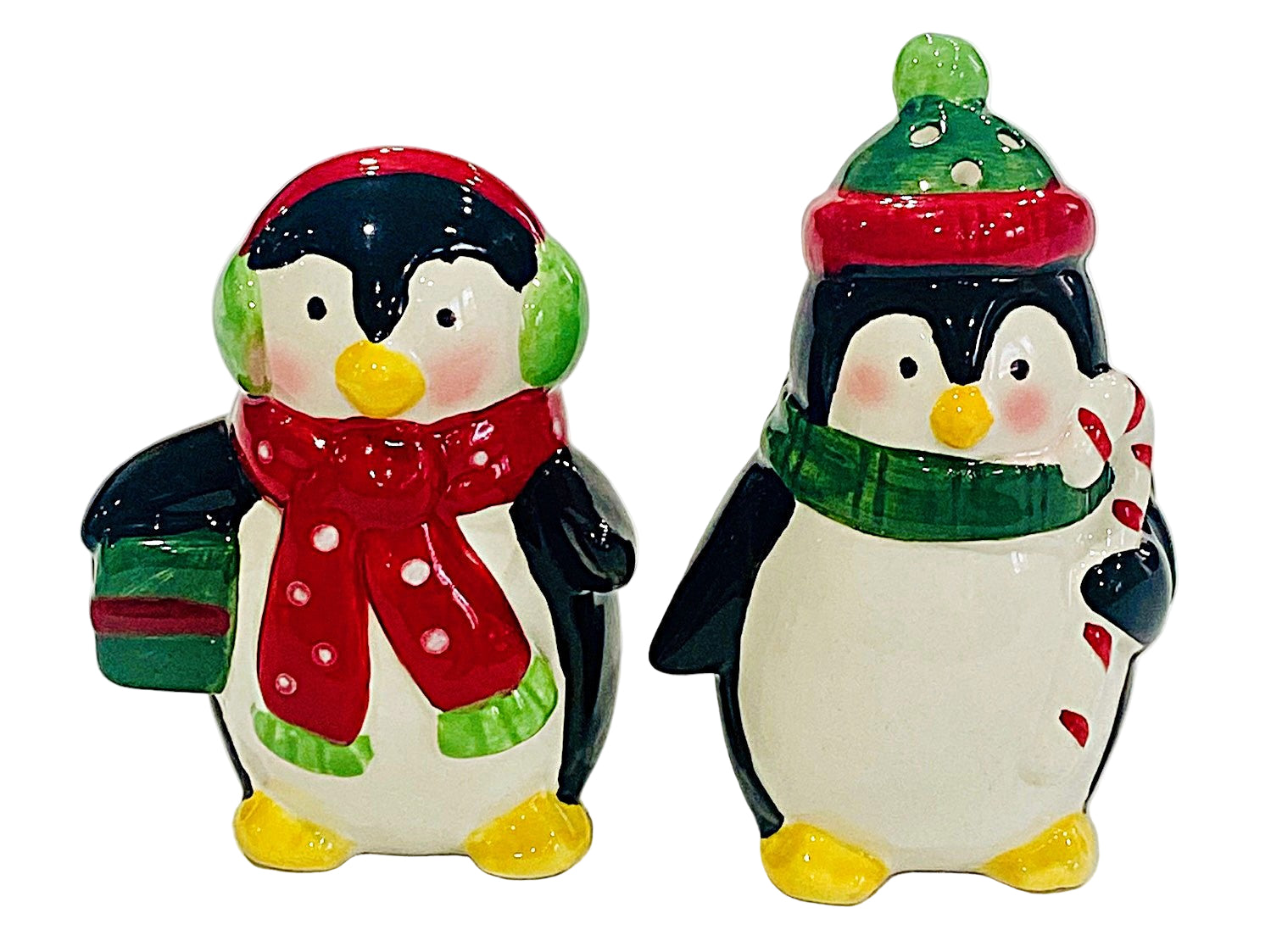 Two ceramic penguin salt and pepper figures with winter accessories on a white background