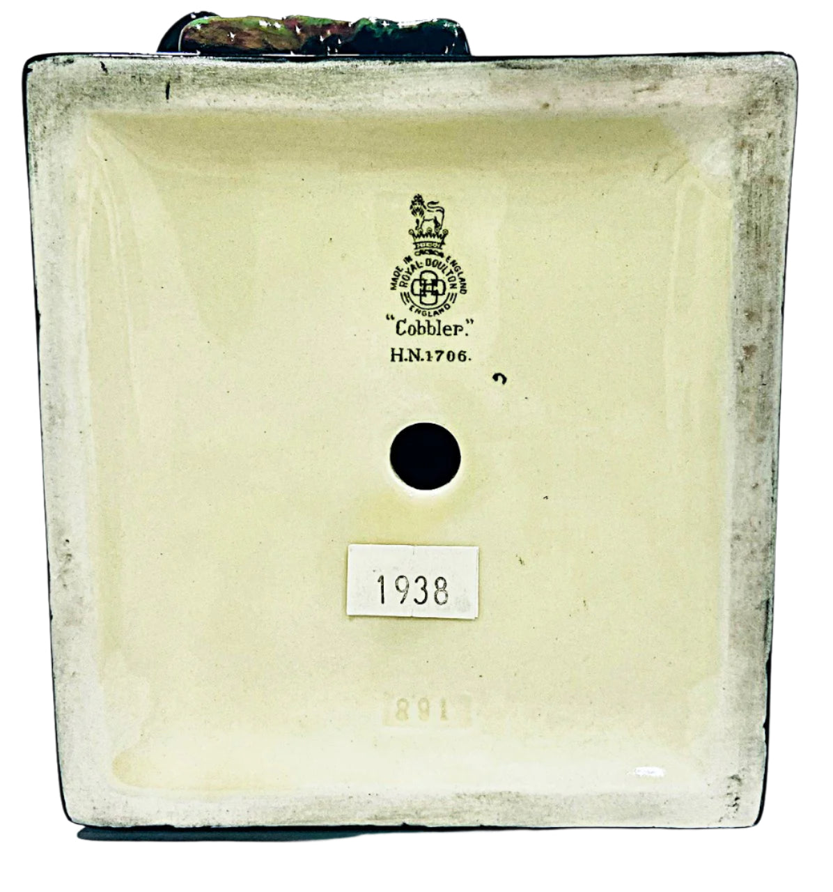 Back view of a ceramic item with a brand logo and number '1938' on a white background