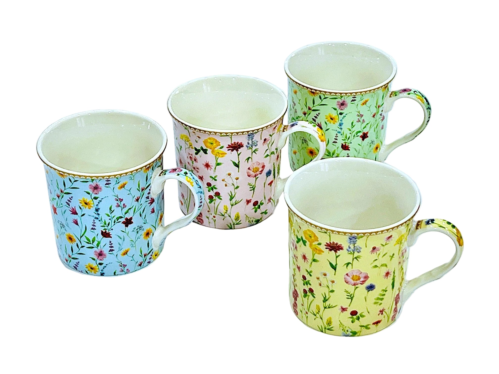 Four floral-patterned mugs on a white background