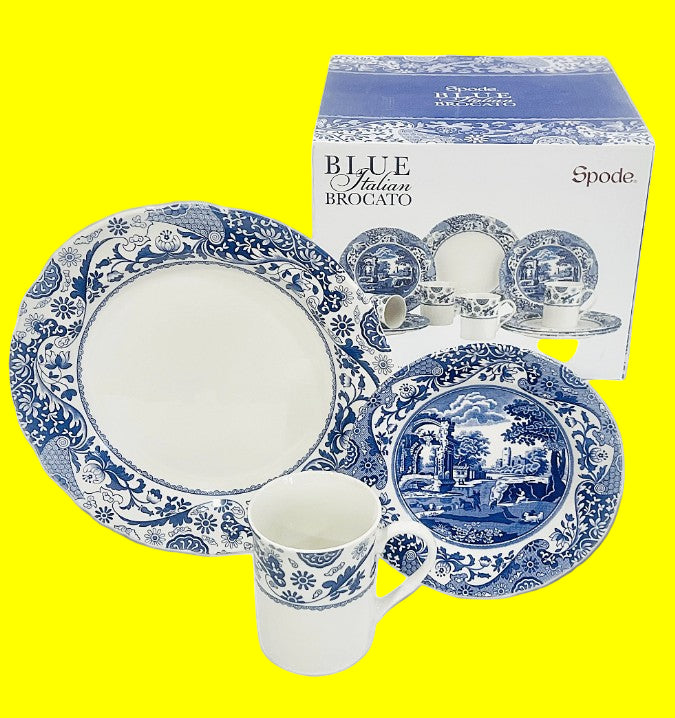 Spode Blue Italian Brocato dinnerware set with a cup and two plates on a dark background.