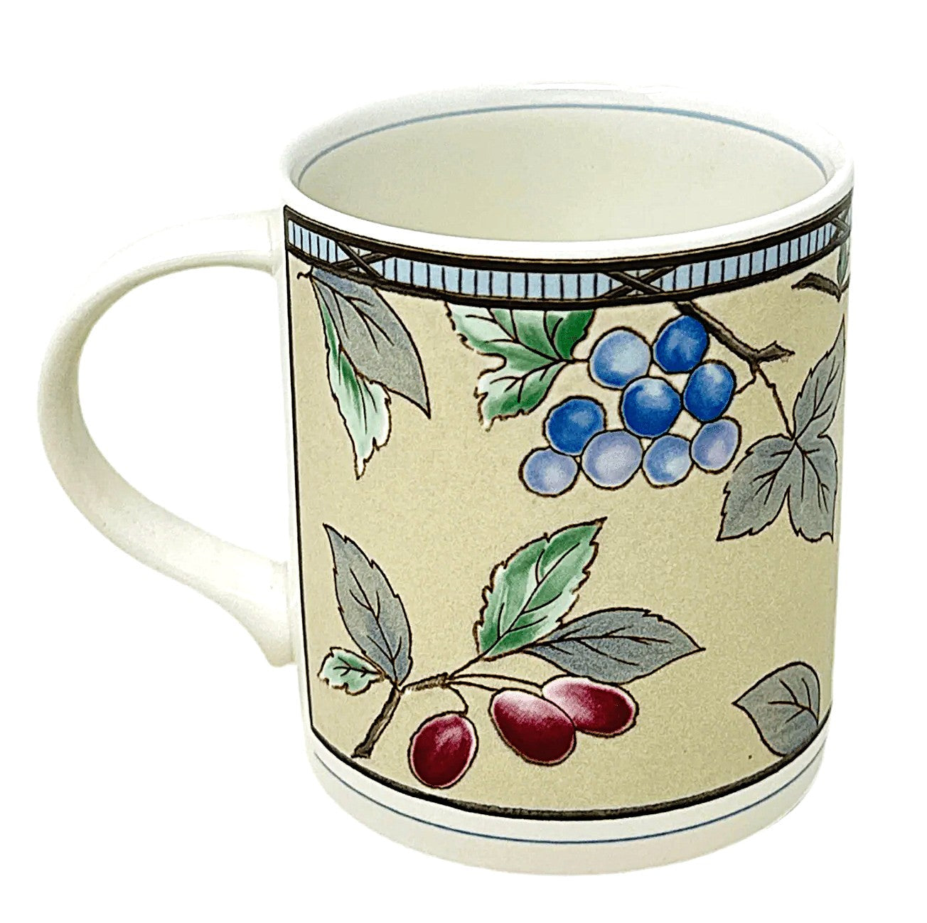 Ceramic mug with floral and berry design on a beige background