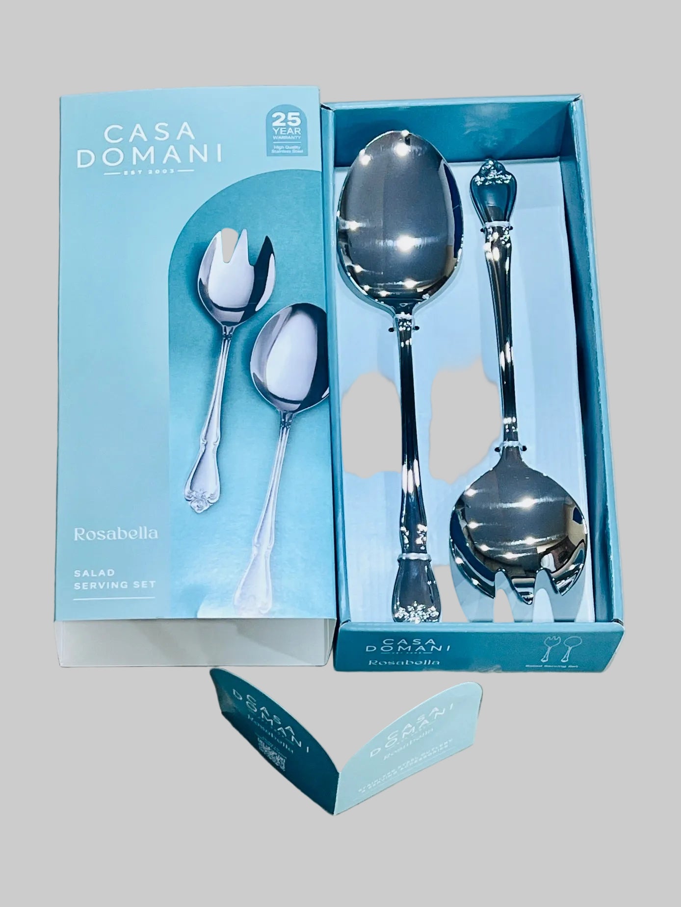Casa Domani Rosabellla silver serving set in packaging on a light gray background
