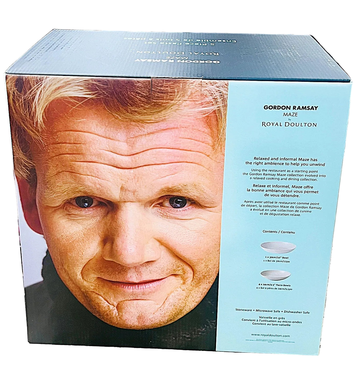 Box with a face of a person on one side and text on the other, placed on a kitchen counter.