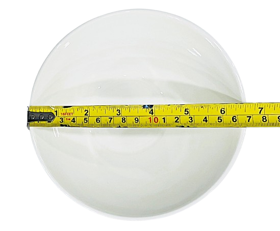 Measuring tape on round white Cereal Bowl