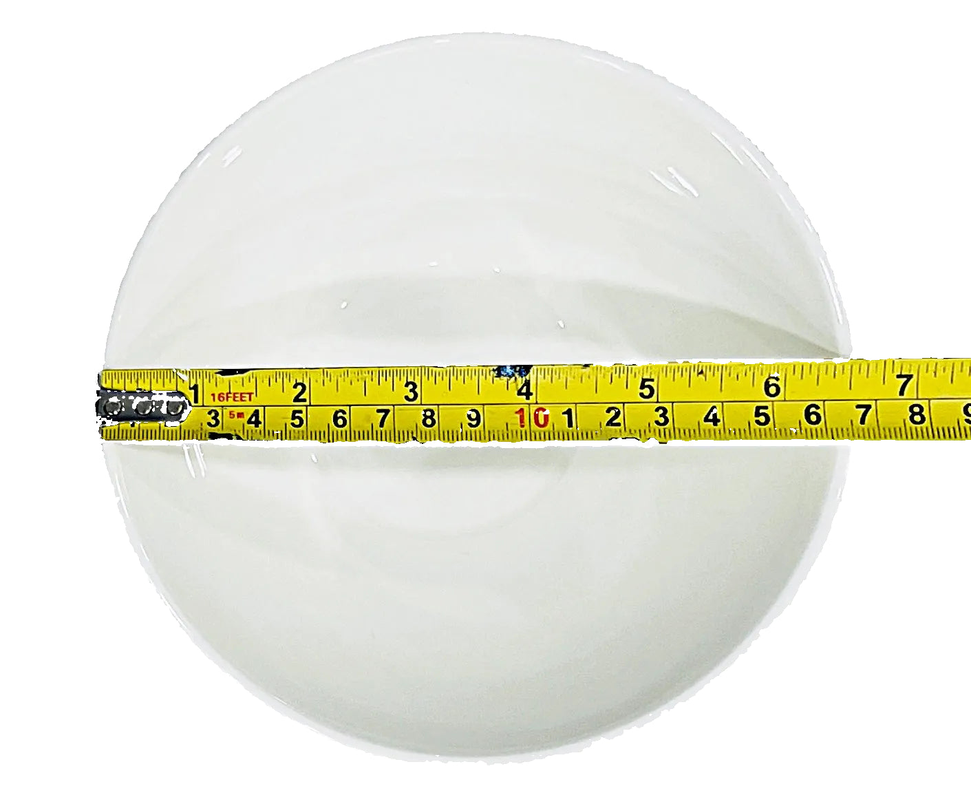 Measuring tape on a white bowl against a white background