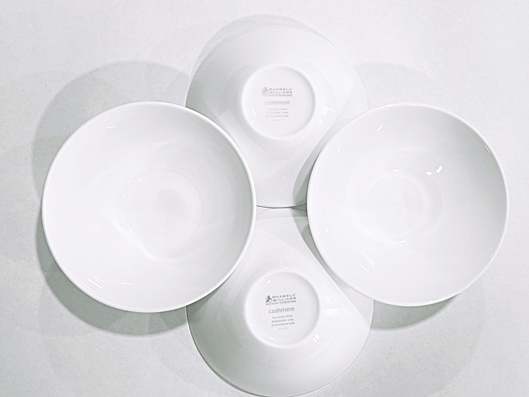 4 white bowls on a white background