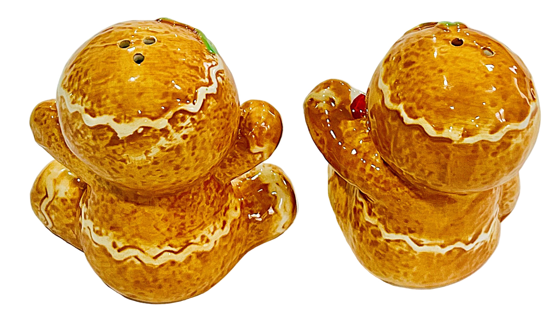 Two orange ceramic ginger bread salt and pepper