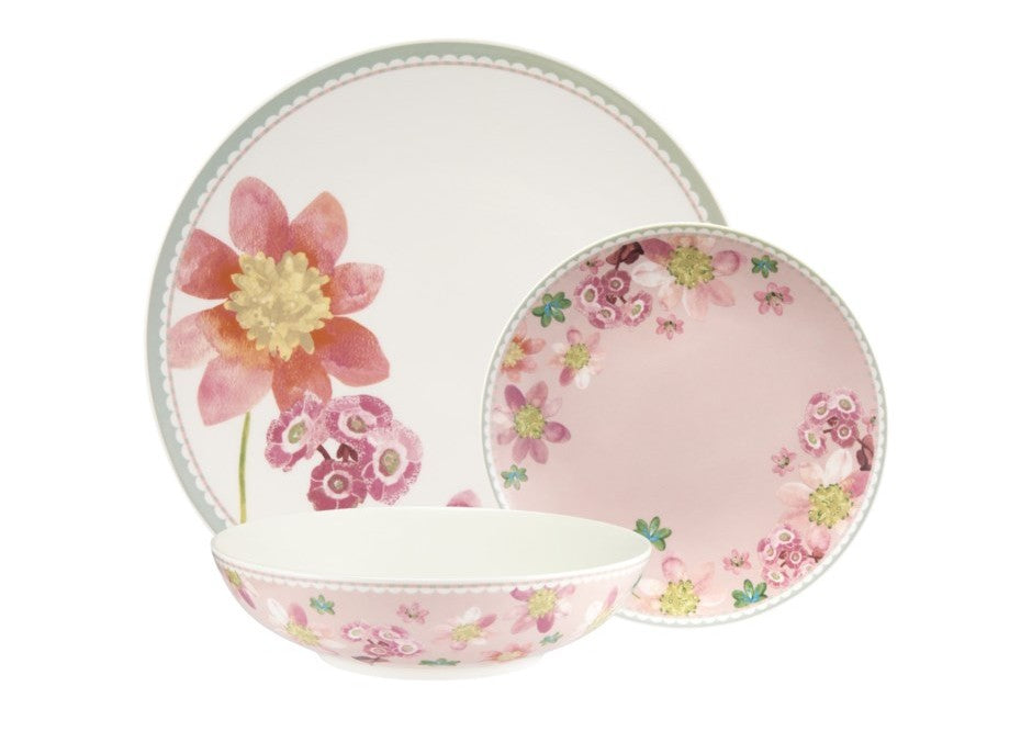 Set of floral-patterned ceramic plates on a white background