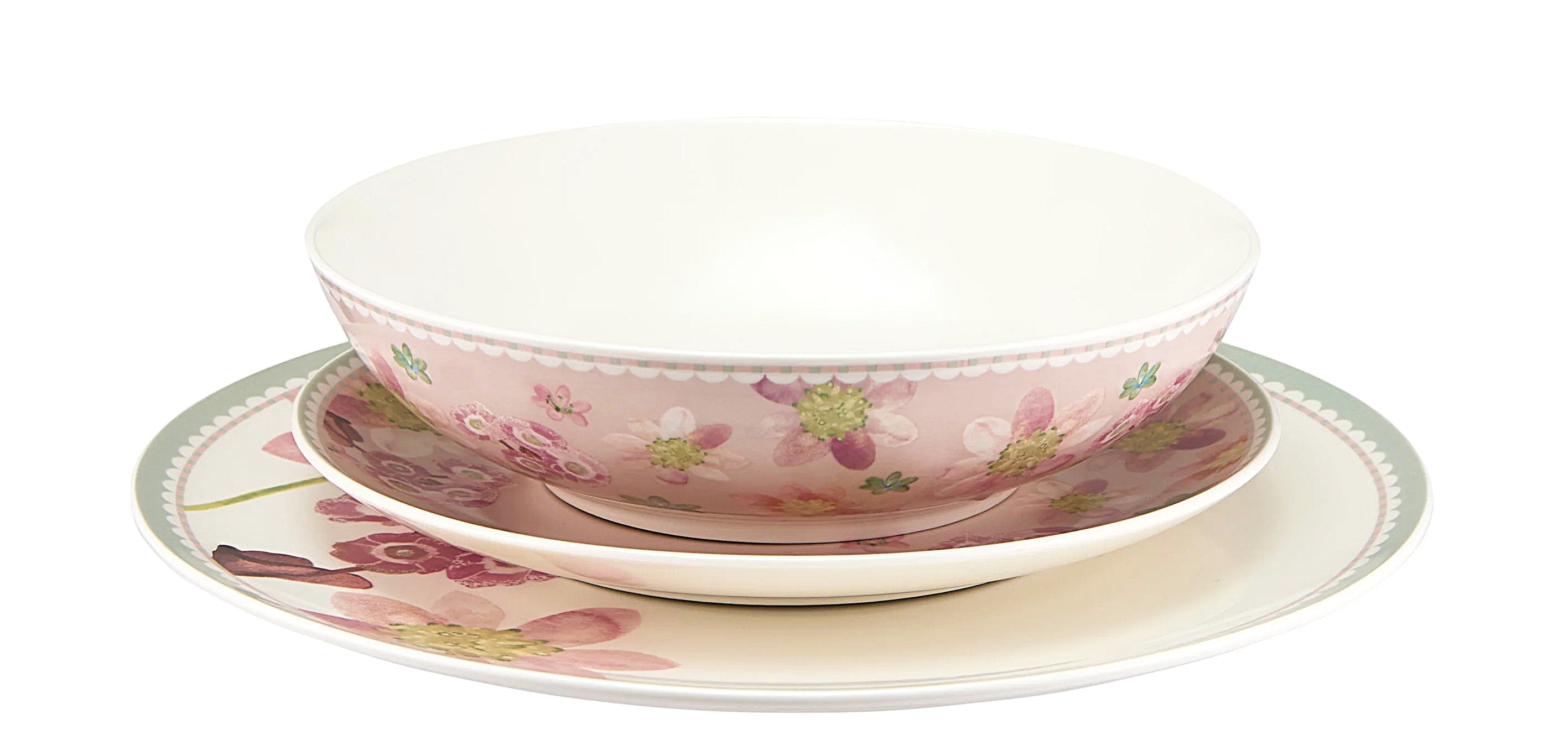 Set of floral ceramic dishes on a white background