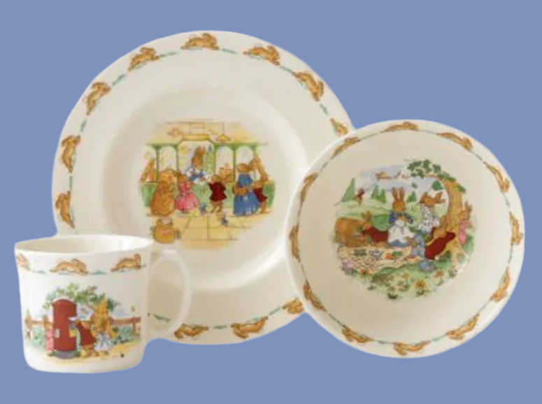 Bunnykins tableware 3 piece set with illustrated design on a blue background
